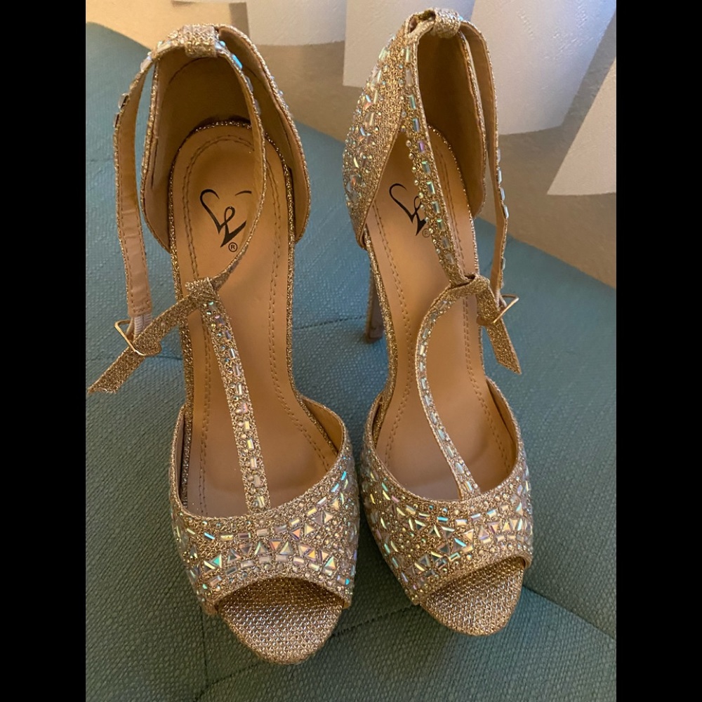 Stiletto Gold heels worn once. Woman’s 6.5